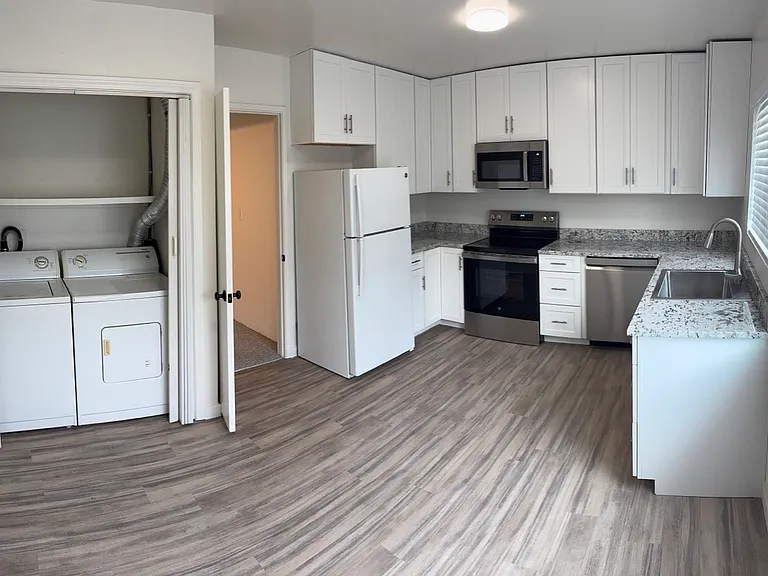 Shows position of full size washer and dryer