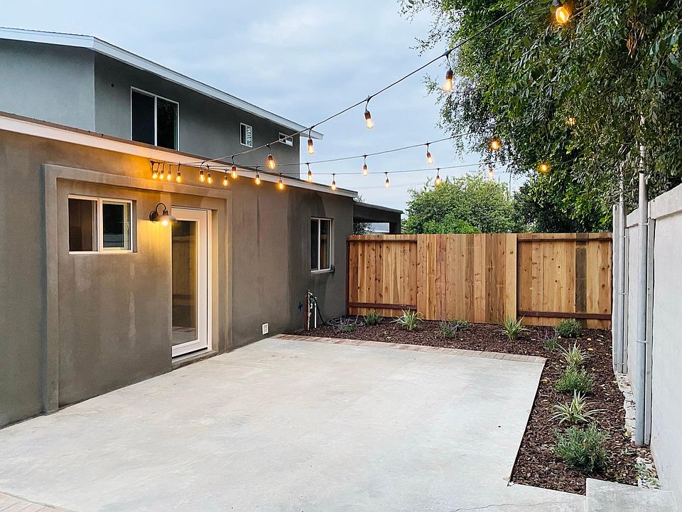 Front porch (back patio) with bistro lights.