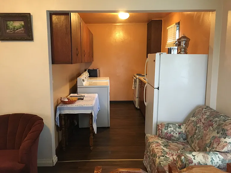 Kitchen has full sized refrigerator, stove/oven, microwave over and Washer and Dryer too! There are lots of cabinets!