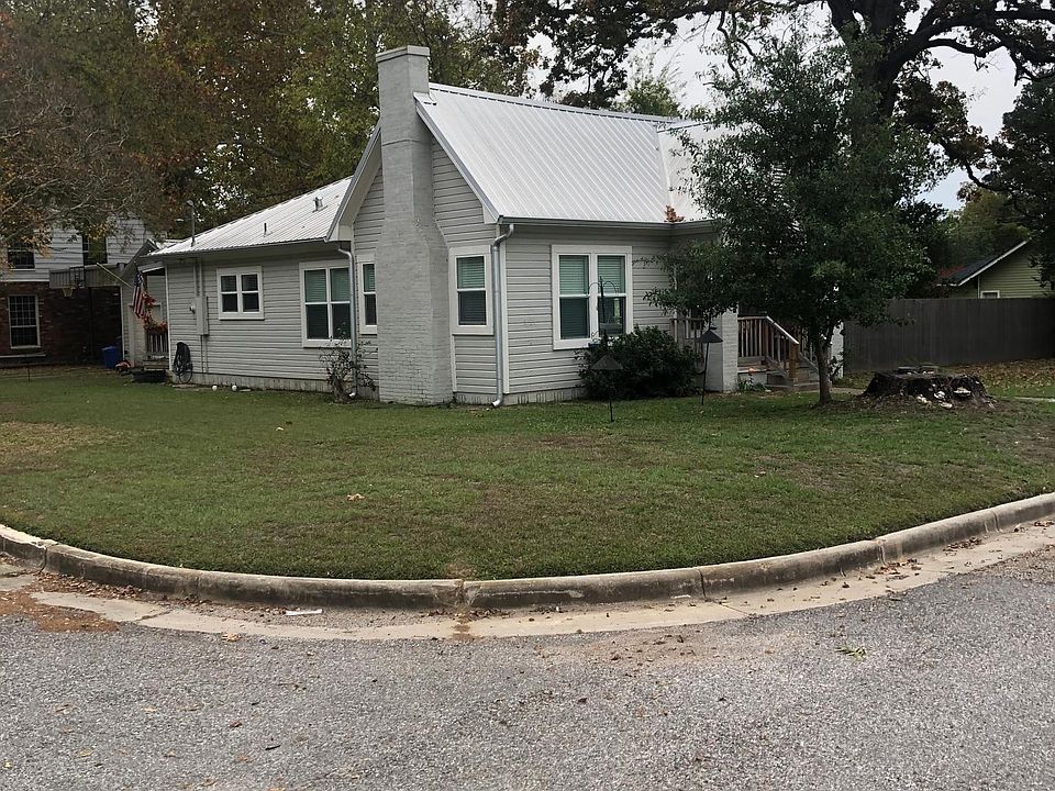Corner lot view with beautiful oak tree in the back ground