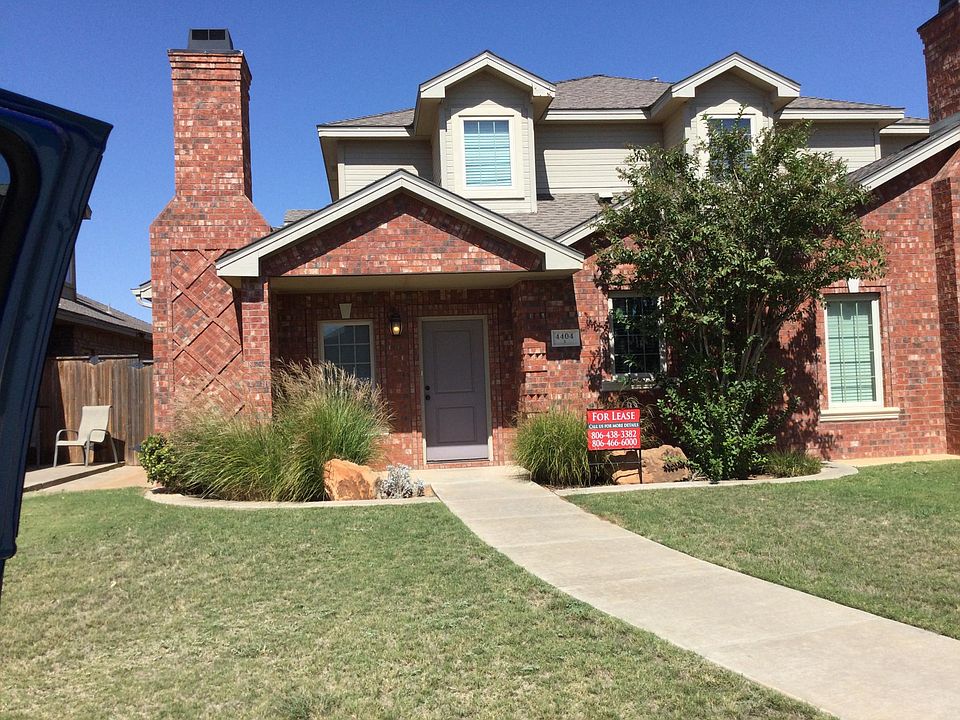 Front entry and yard. Porch is large enough for seating.