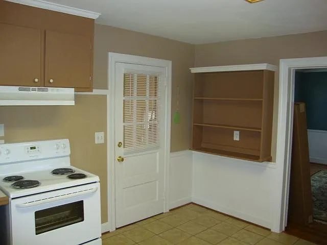 Kitchen view of garage/laundry and dining room entrances