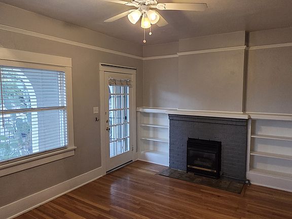 Built in shelves and original refinished hardwood floors