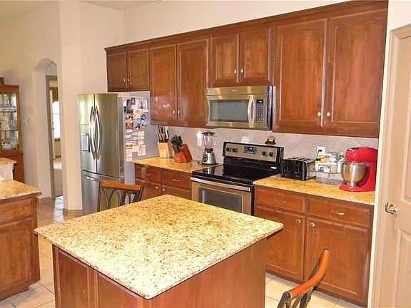 Kitchen has Stainless appliances.