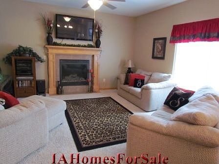 Living Room has custom fireplace, open floor plan with 9ft ceilings throughout.