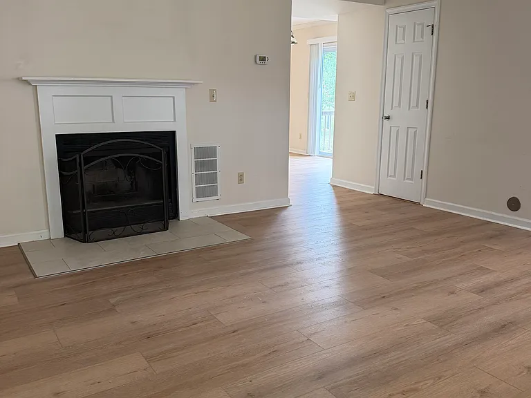 Wood burning fireplace, tile and luxury vinyl plank