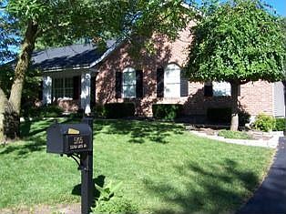 Front with arched windows, beautiful weeping cherry 