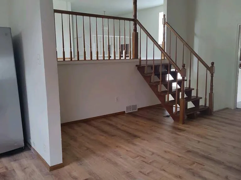 Mid level living area to kitchen and 2 car attached garage