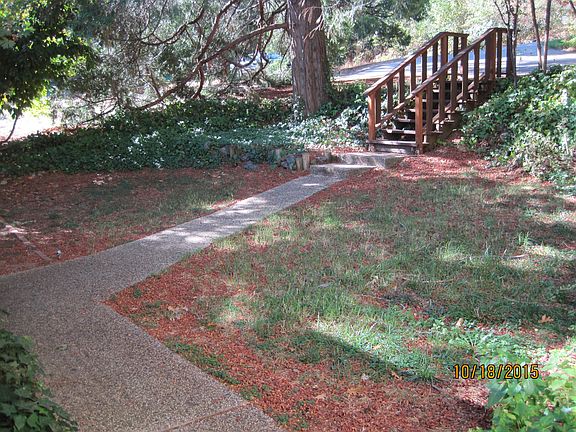 Rear Yard with stairs to 2nd level parking area