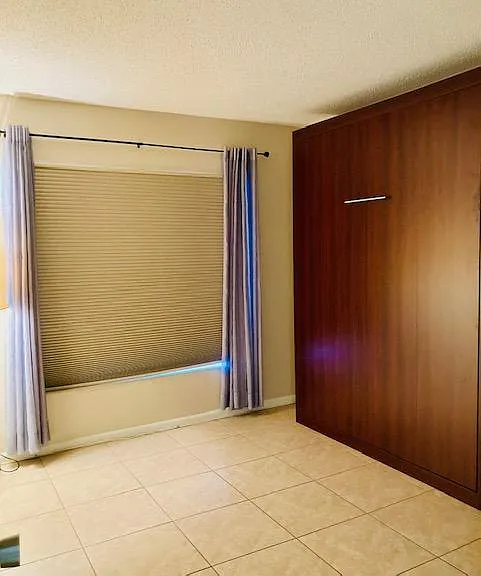 Bedroom 2: Murphy bed and built in desk.