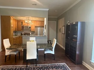 Dining area adjacent to the living room can seat up to 8.