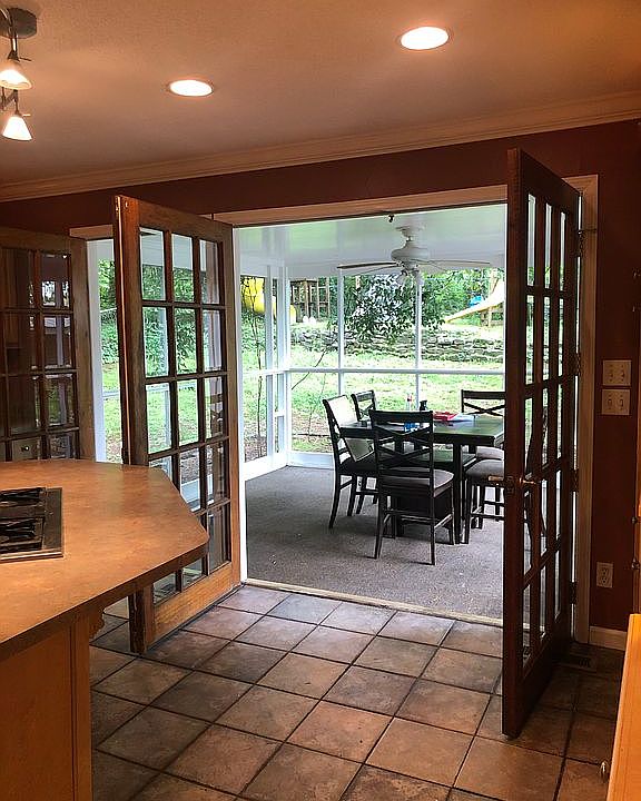 Kitchen opens to outdoors
