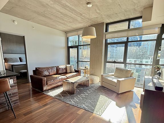 Enjoy floor to ceiling windows. city views. 10' ceilings.