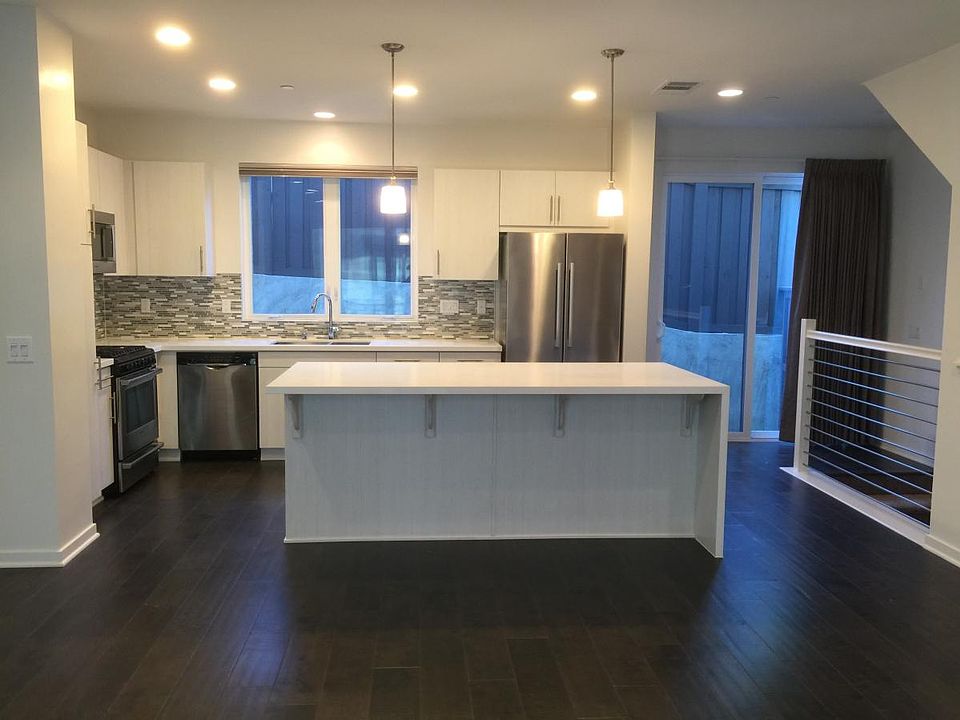 Kitchen with center island, access to enclosed rear yard.