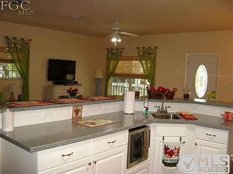 new cabinets, wine cooler, sink and faucets