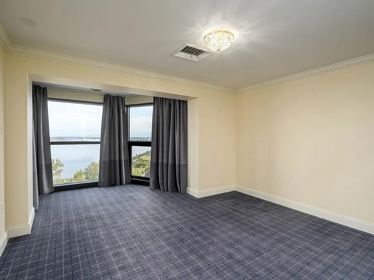 Large 2nd bedroom with river views and large closet.