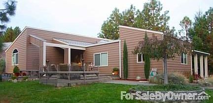 Front yard deck view
						:
						Large 24x14 deck w/firepit and surrounding bench, and planter beds.