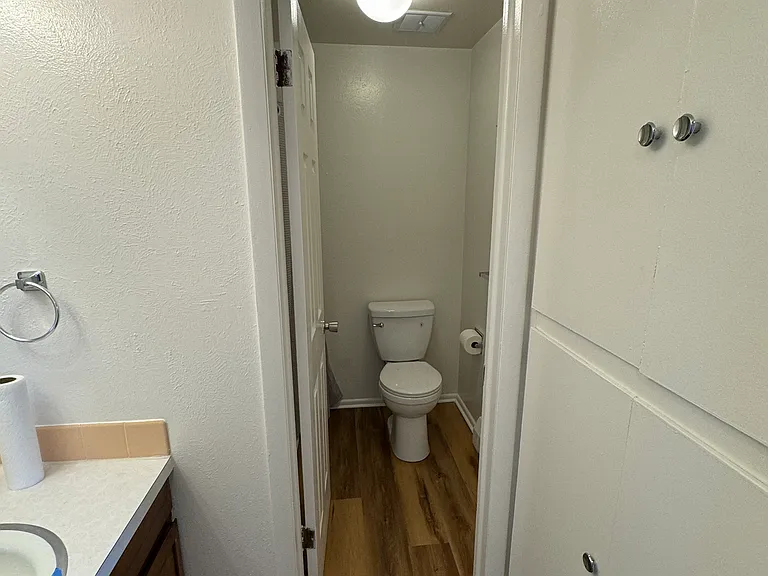 Bathroom with separate tub and toilet area.