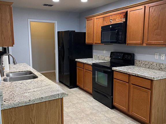Kitchen looking into walk-in pantry/laundry room