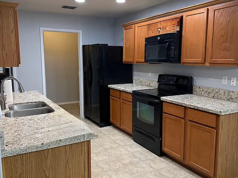 Kitchen looking into walk-in pantry/laundry room