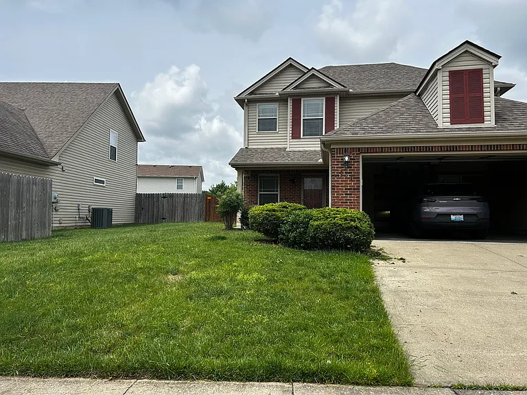Front of home. 2 car garage. Front porch.
