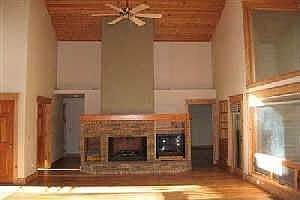 Light filled greatroom with new, hand scraped maple flooring and accent walls