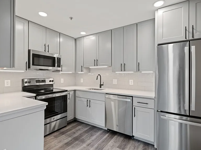 Select homes feature upgraded kitchens with quartz countertops and wood flooring