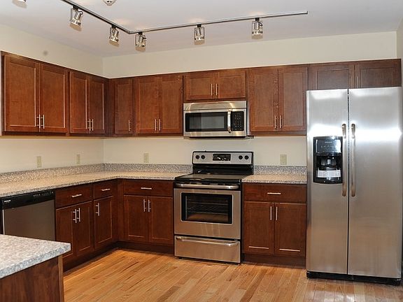 Kitchen with Brand New stainless steel appliances, and grani