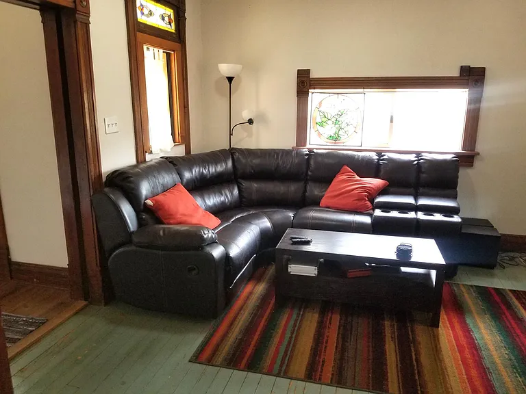 Living room w former tenant's furniture