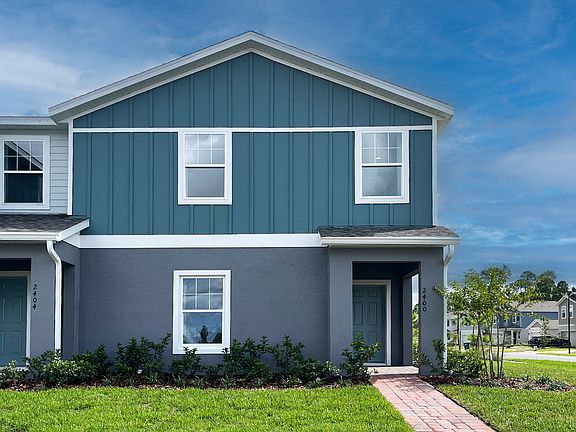 Ashley townhome exterior with covered porch in Pine Meadows, new construction in Eustis FL