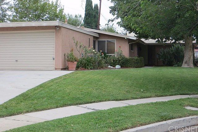 Front of House and Beautifully landscaped yard