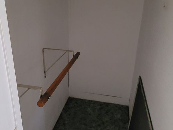 Main bedroom has a walk-in closet with separate closed storage shelving on wall. Good size with good lighting.