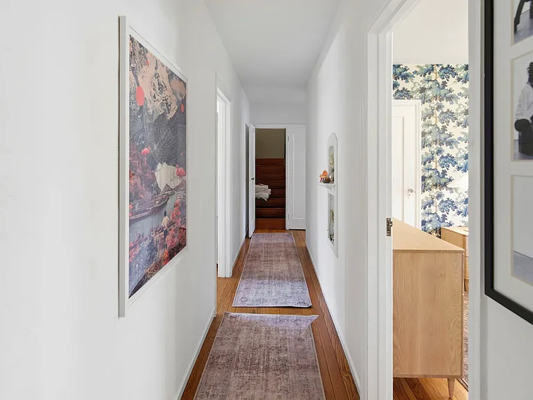 This is the hallway on the main floor to the blue room, bathroom and two other bedrooms.