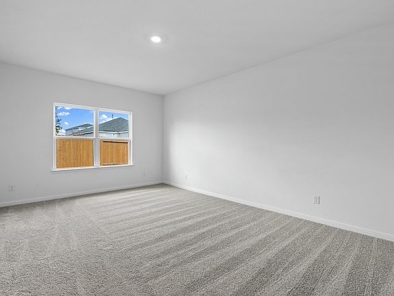 The master retreat has its own bathroom and walk-in closet.