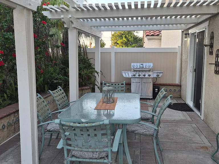 backyard dining with free standing gas BBQ