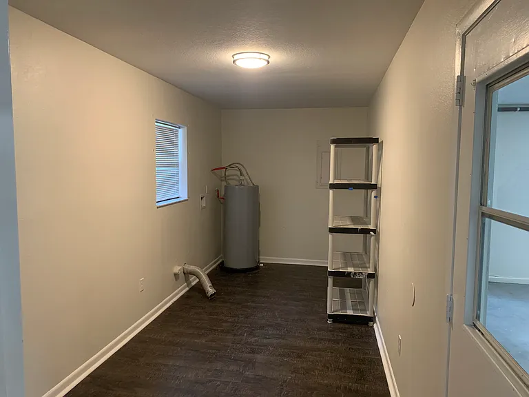 Laundry room that leads to garage