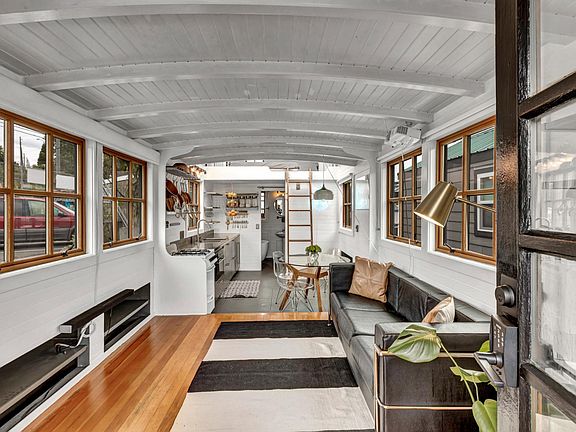 Upon entering, you're greeted with a modern interior, arched ceilings and warm wood accents.