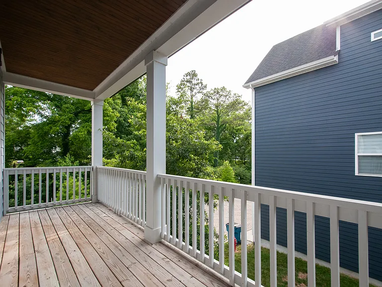 Covered porch off the living room offering an added outdoor space