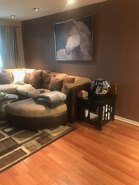 Living room - Tenant is leaving couch w/ most pillows 