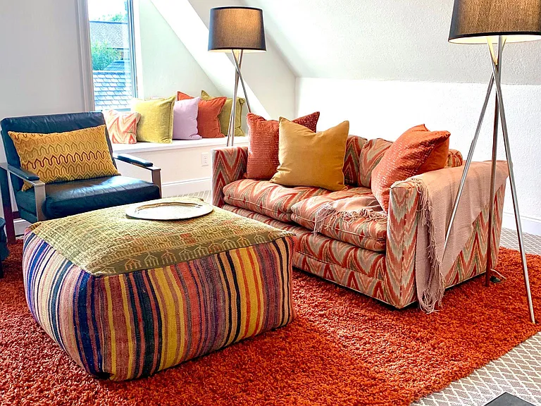 Light filled living room with wet bar.