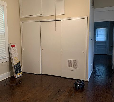 Middle room bedroom with walk in closet.