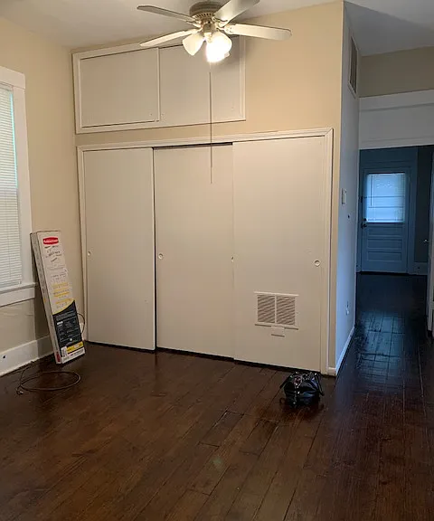 Middle room bedroom with walk in closet.