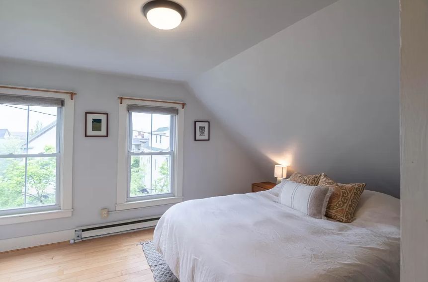 Main bedroom with views toward the Eastern Promenade. Walk-in closet.