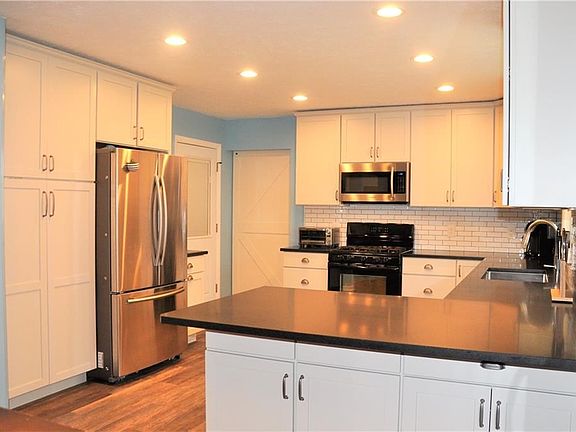 All kitchen appliances are included.  Please Note: Refrigerator seen in this photo will be replaced with a stainless steel side-by-side for the new buyer.