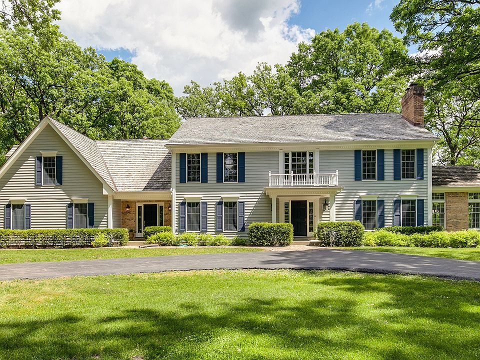 Beautiful colonial set among mature trees on large private lot. Circular drive greets you as you app