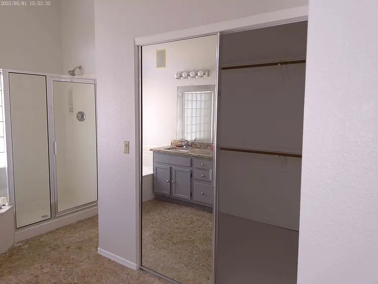 Master Bathroom showing closet and shower.