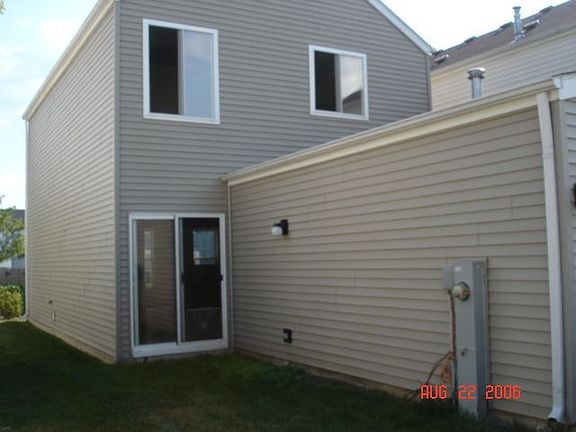 Back walkout area with lawn.