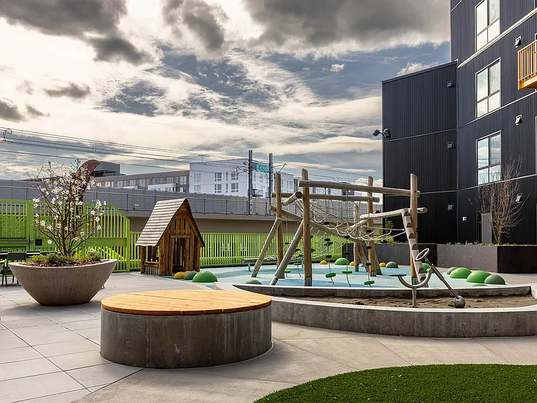 East Building Backyard amenity featuring an all-ages playground