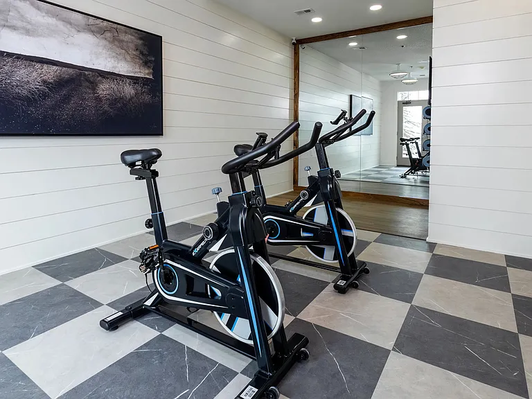 Cycle enthusiasts can enjoy a dedicated spin studio adjacent to the fitness center, providing an immersive workout experience.