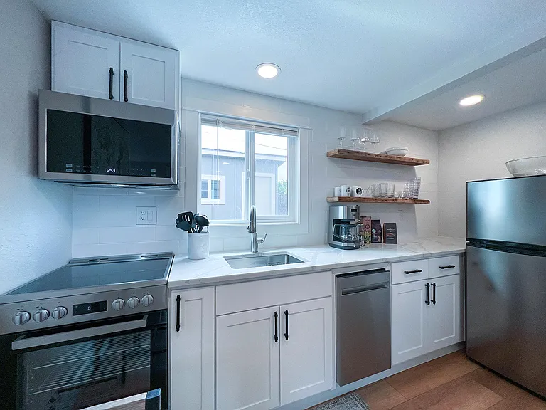 stainless steel appliances with deep sink and garbage disposal